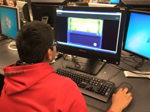 Student practicing Riddle Books on a computer