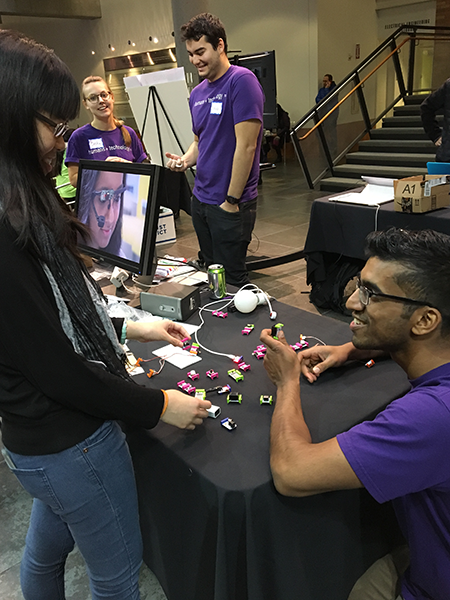 A student tries an interactive demo at the 2016 Computing Open House