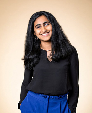 Mitali Palekar smiling with hands in pockets
