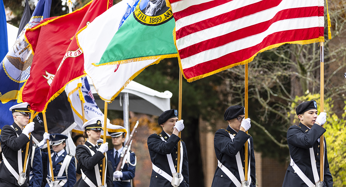 Reserve Officers’ Training Corps (ROTC) members carry flags during the University of Washington's annual Veterans Day Ceremony.