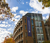 View of the Paul G. Allen School of Computer Science & Engineering building surrounded by trees.