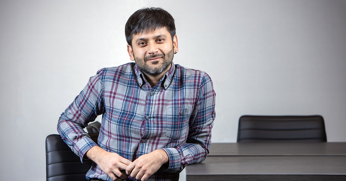 Ratul Mahajan sitting at a desk facing the camera.