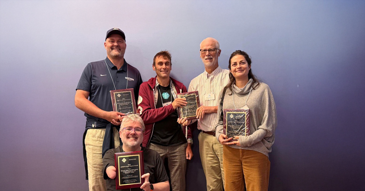 Members of the "Freedom to Roam" research team pose with their SIGACCESS ASSETS Paper Impact Award.