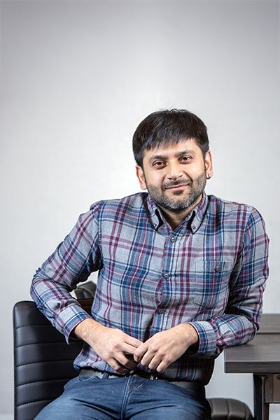 Ratul Mahajan sitting at a desk facing the camera.